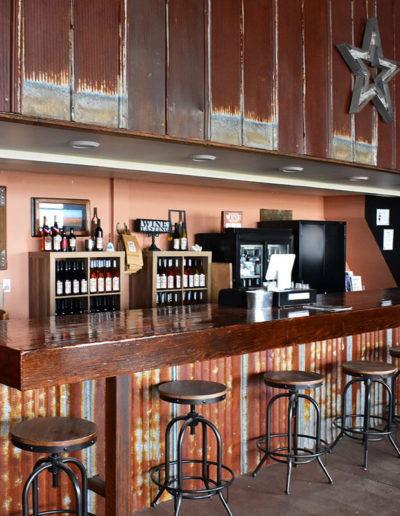 Enjoy the rustic charm of our tasting room while sampling estate wine