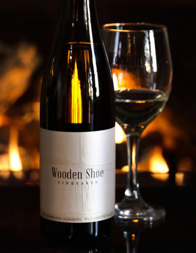 Enjoy Wooden Shoe Vineyards wine by the fire